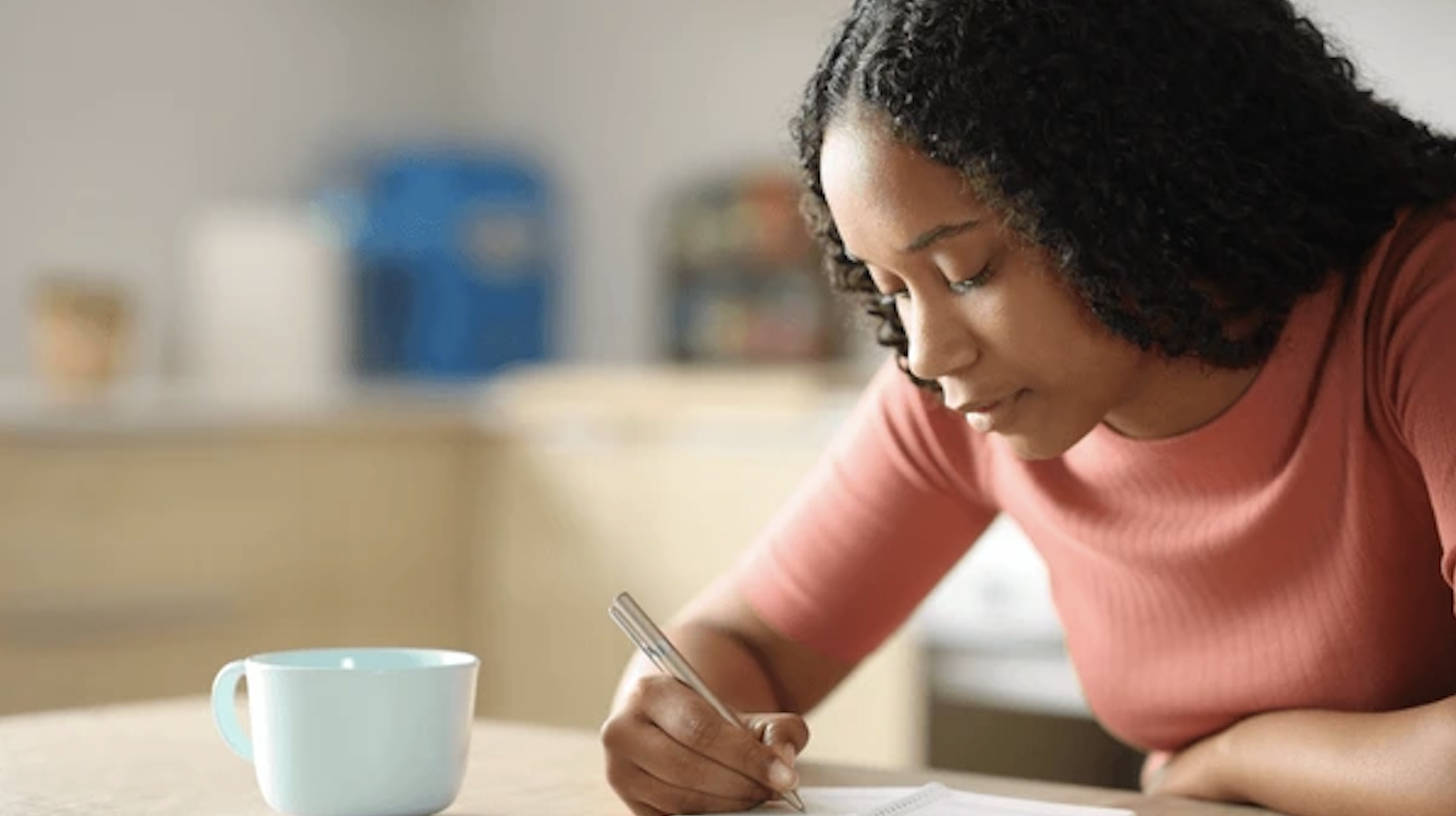 Woman writing in personal diary
